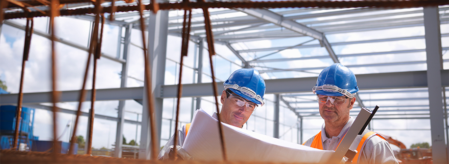 Two Construction Workers Viewing Plans Hero